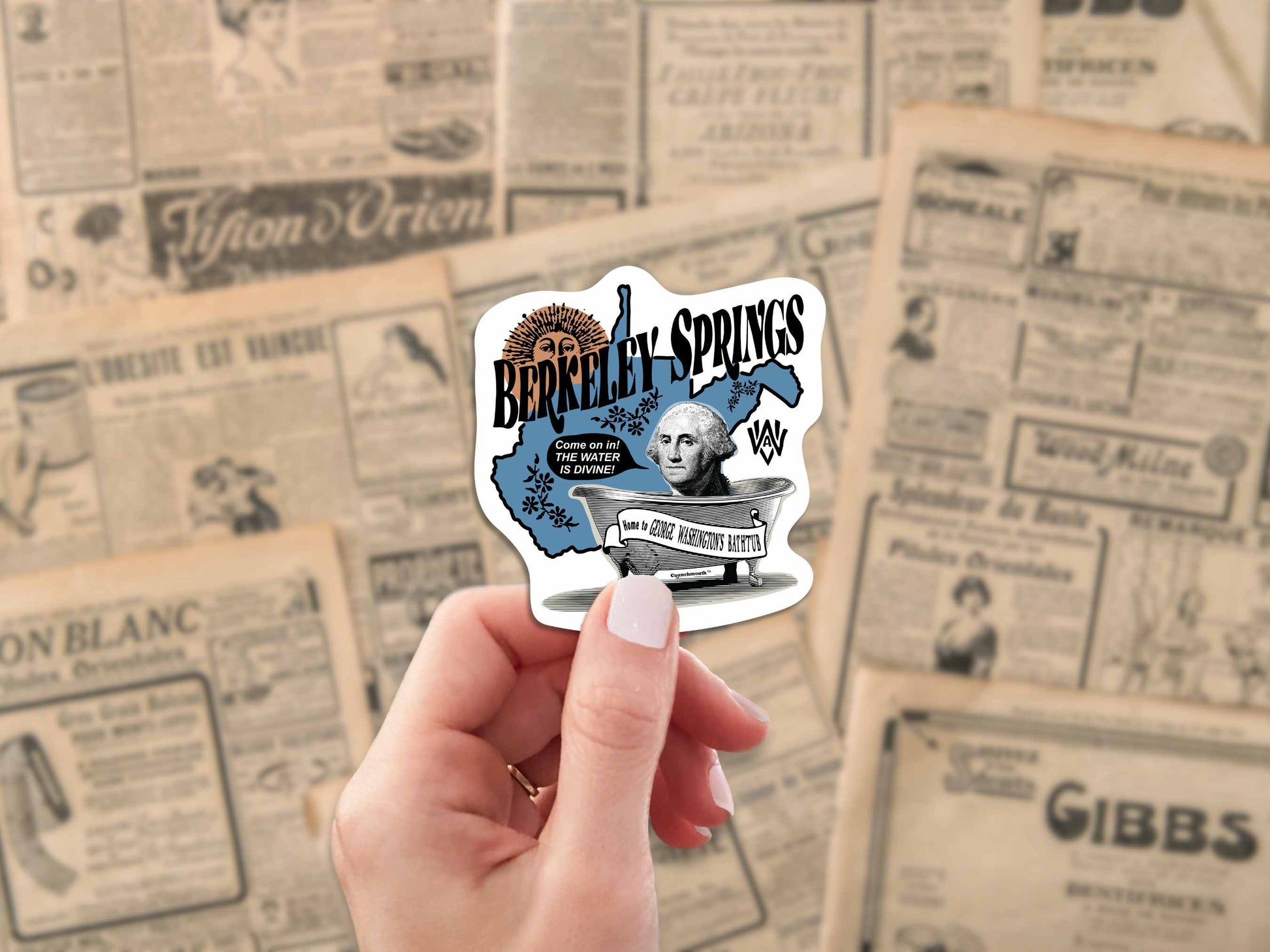 berkeley springs travel luggage sticker, hand display, antique newspaper backgound