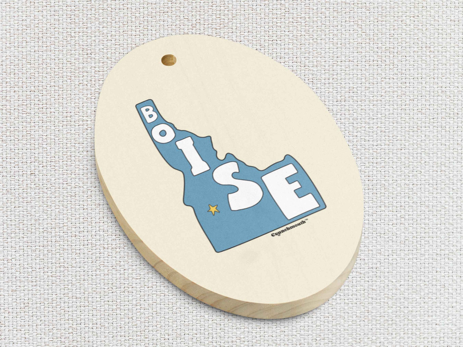 boise Christmas ornament, front bottom left side, white textured background