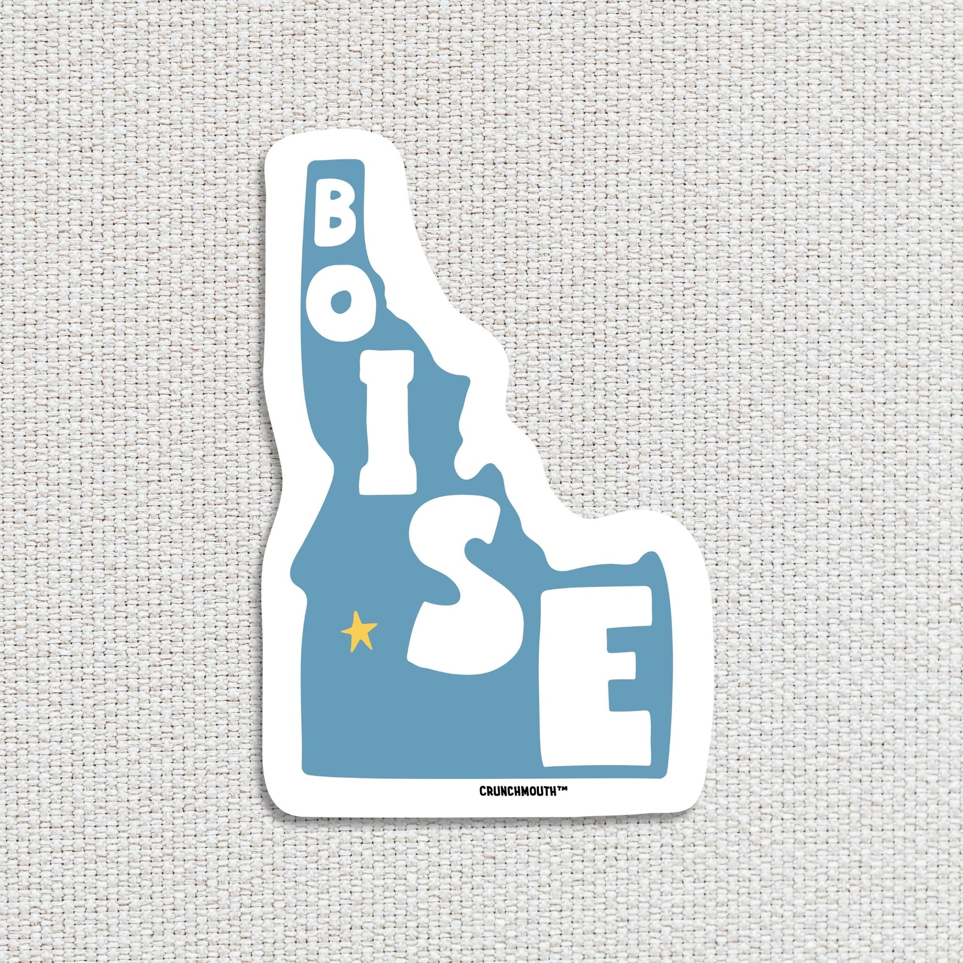 boise travel luggage sticker, textured fabric background
