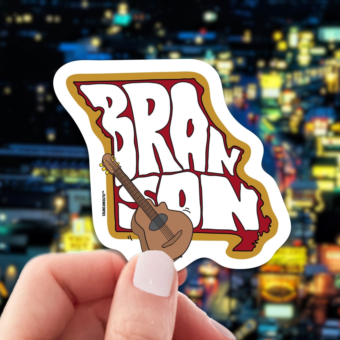 branson travel luggage sticker, hand display, Missouri Highway 76 Country Music Blvd background