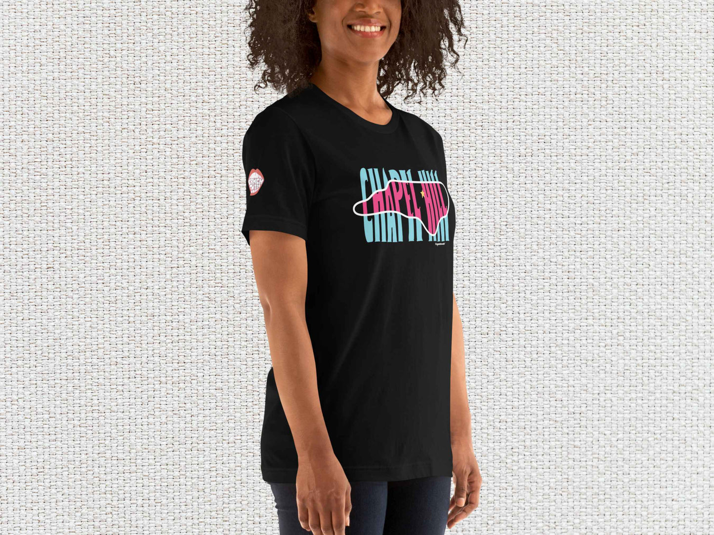 chapel hill north carolina souvenir t shirt, female model, front right, white textured background