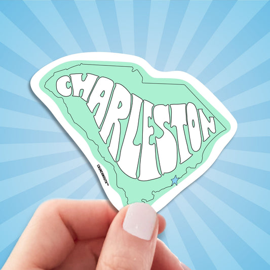 charleston travel luggage sticker, hand display, sun rays design background
