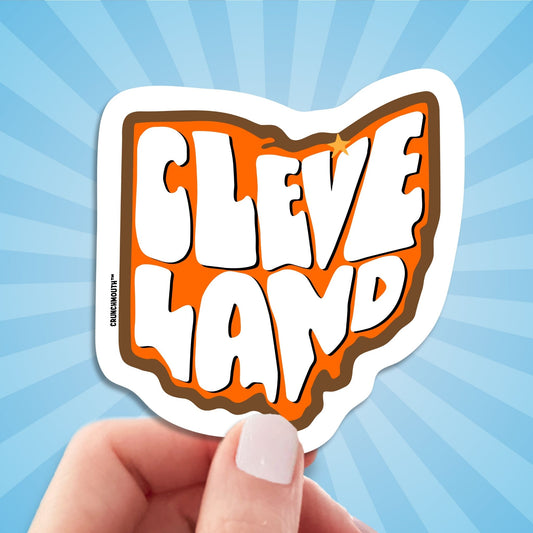 cleveland travel luggage sticker, hand display, sun rays design background