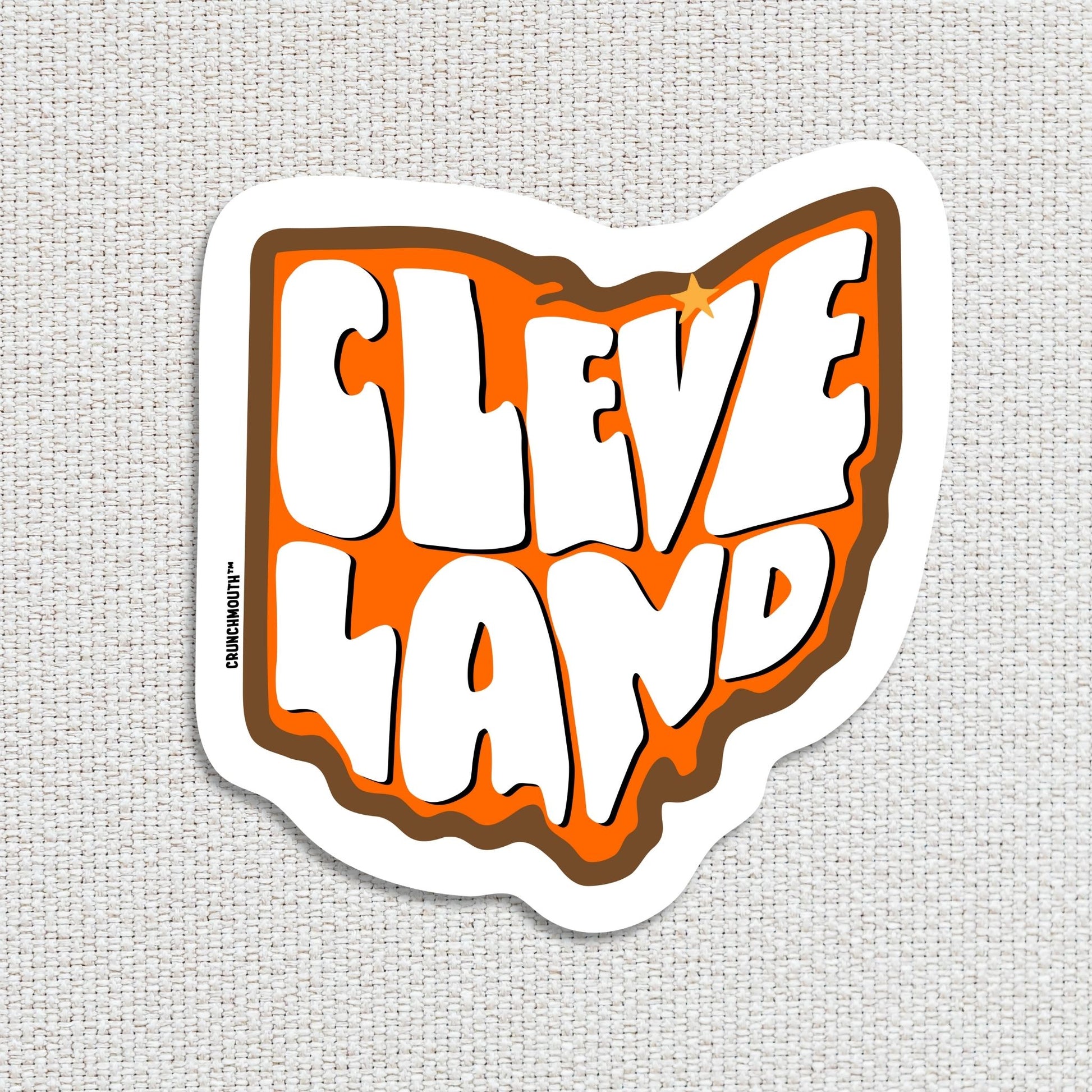 cleveland travel luggage sticker, hand display, white textured fabric background