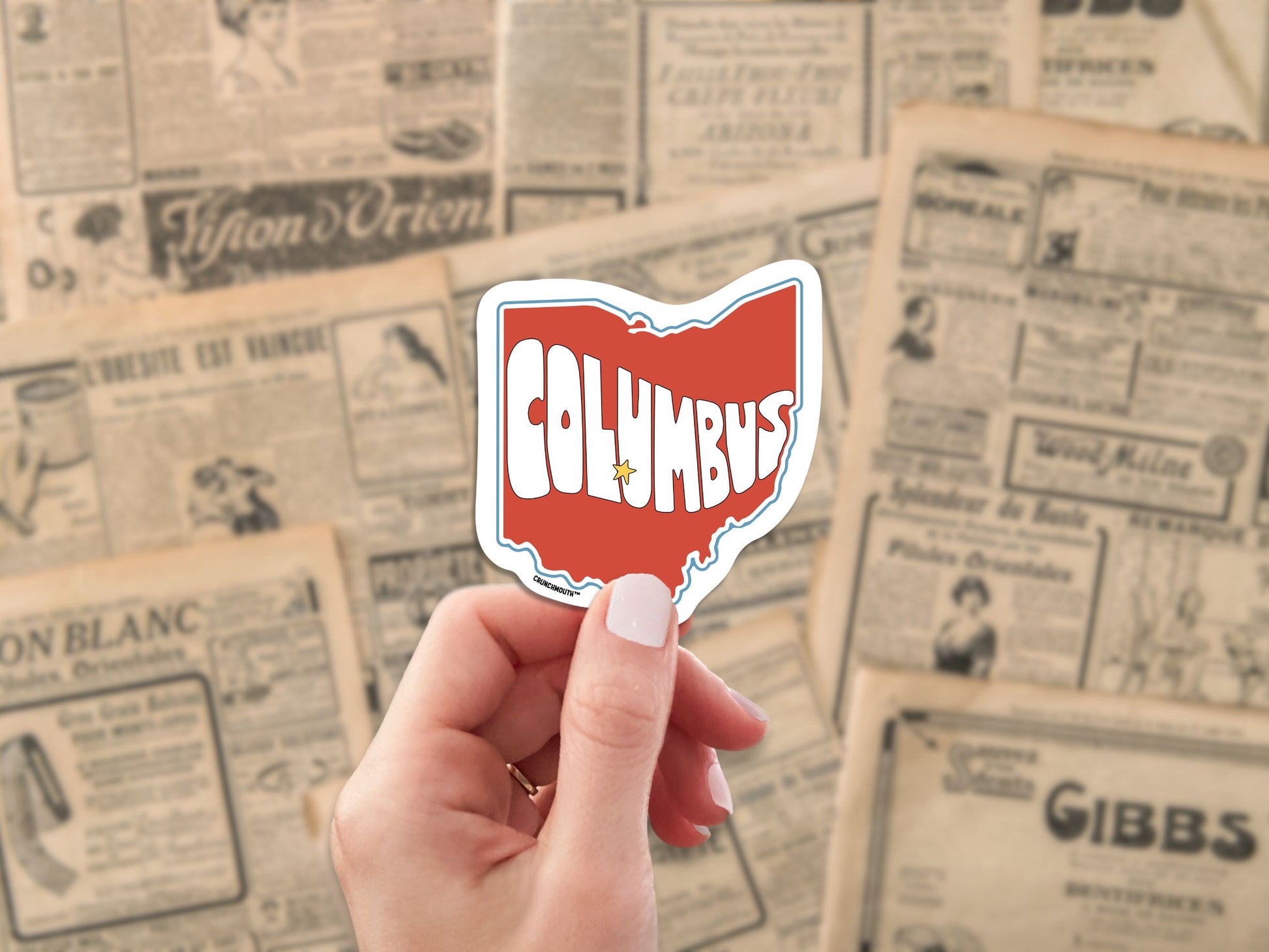 columbus ohio travel luggage sticker, hand display, antique newspaper ads background