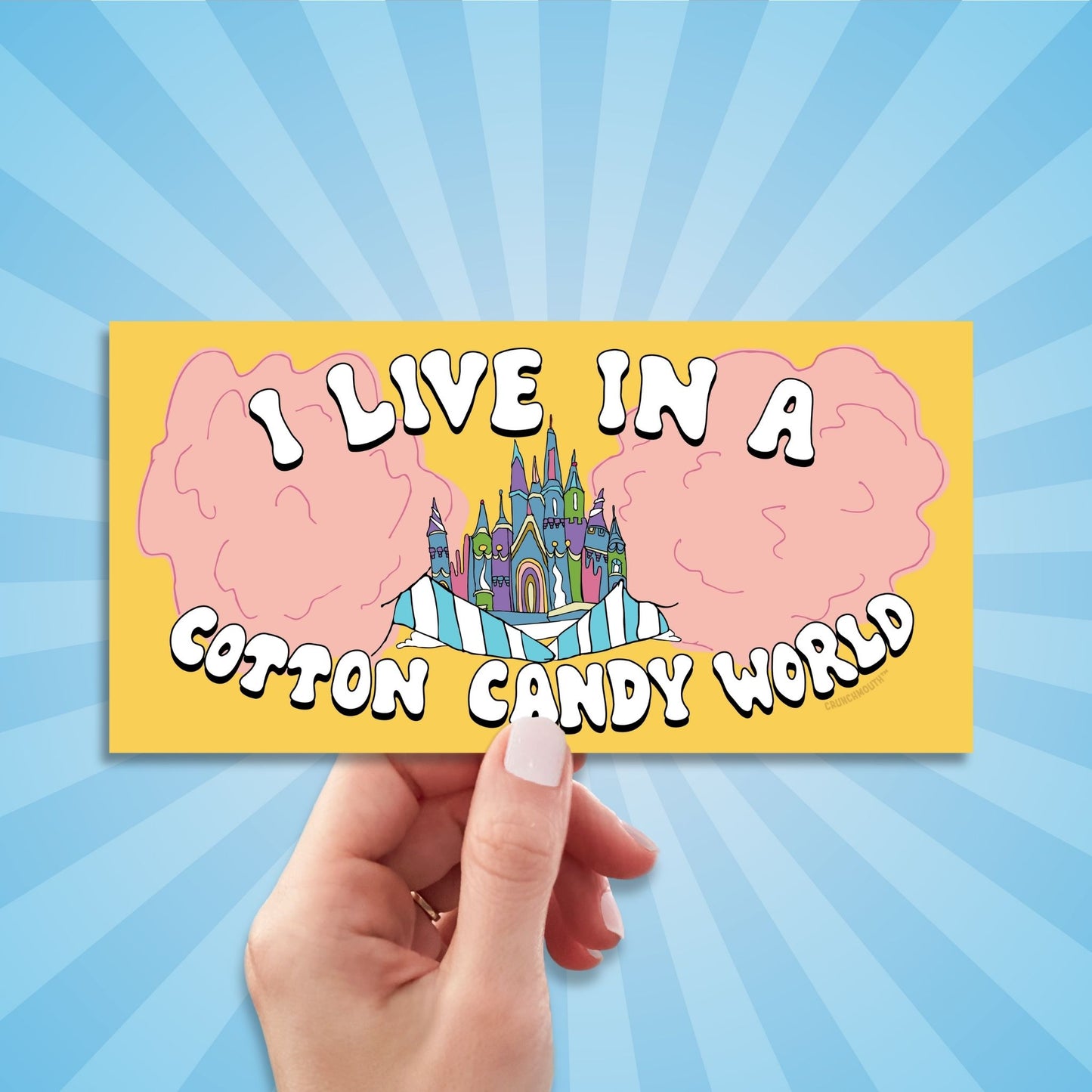 i live in a cotton candy world bumper sticker, hand display, sun rays design background