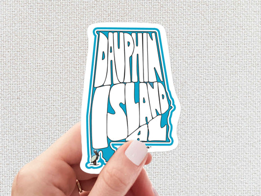 dauphin island sticker, hand display, white textured background