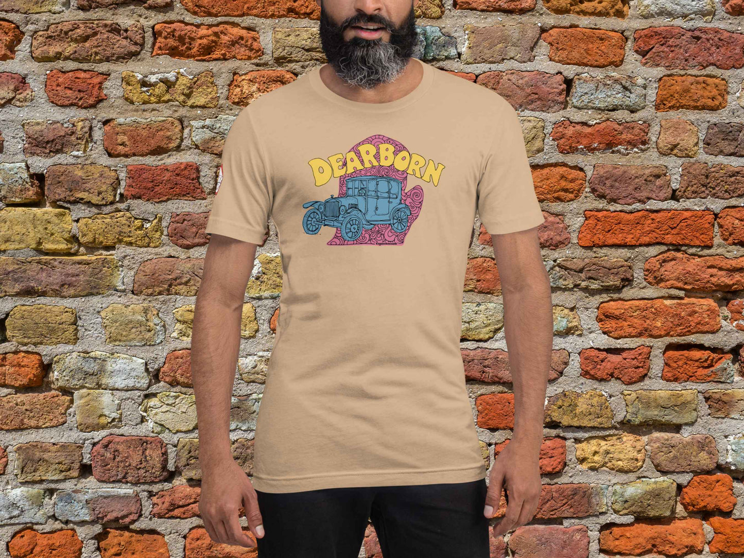 dearborn shirt, souvenir t shirts, front, male model, red brick wall background