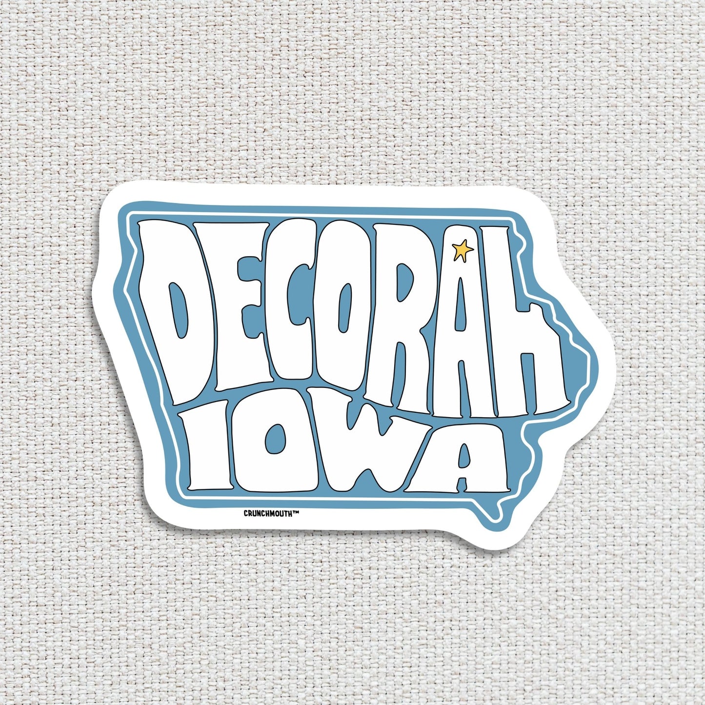 decorah iowa travel luggage sticker, hand display, textured fabric background