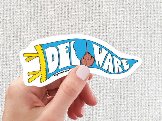 delaware pennant sticker, horseshoe crab, hand display, white textured background