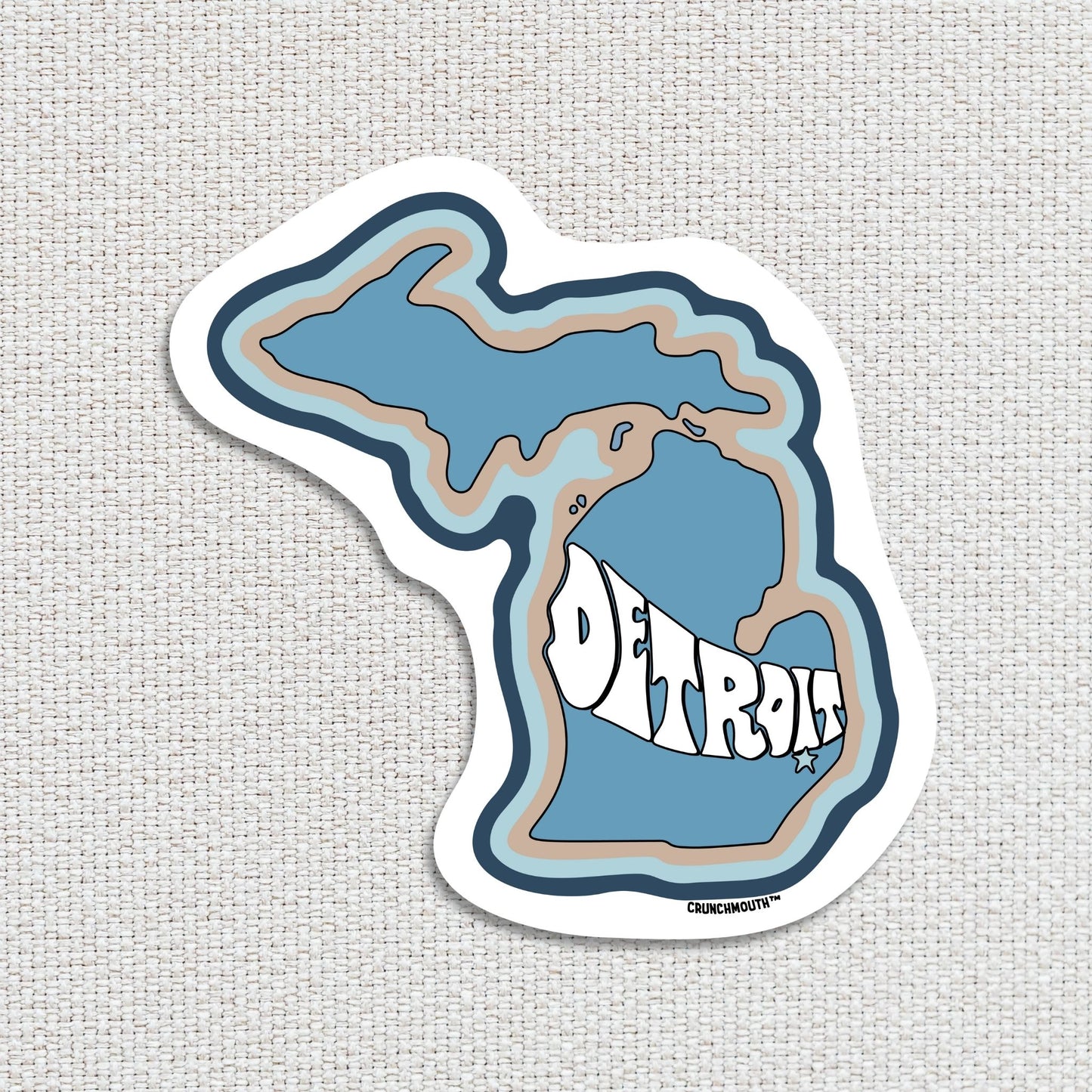 detroit travel luggage sticker, hand display, textured fabric background