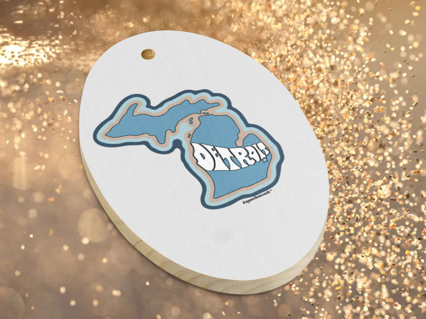 detroit ornament, front bottom left side, gold glitter background