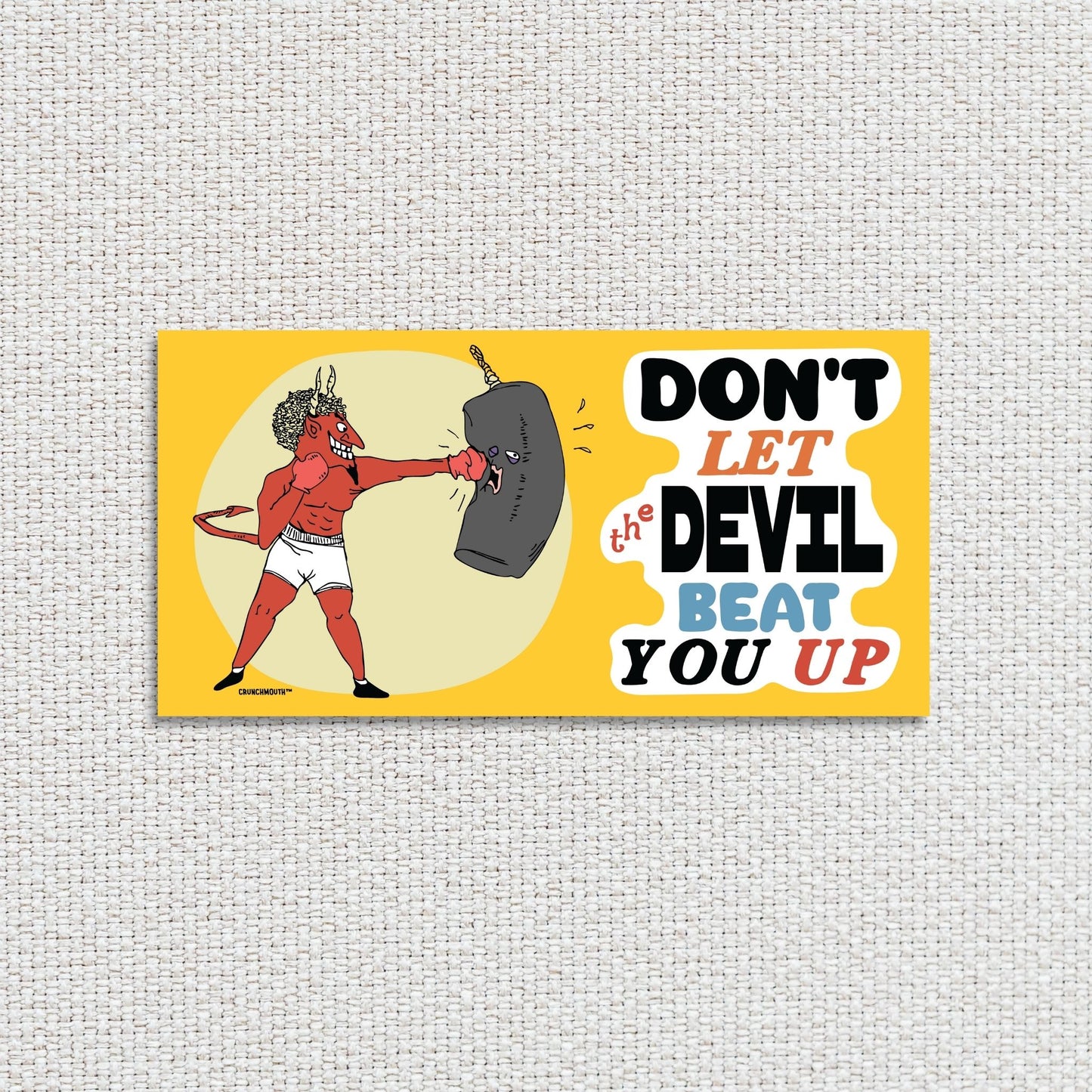 don't let the devil beat you up bumper sticker, textured fabric background