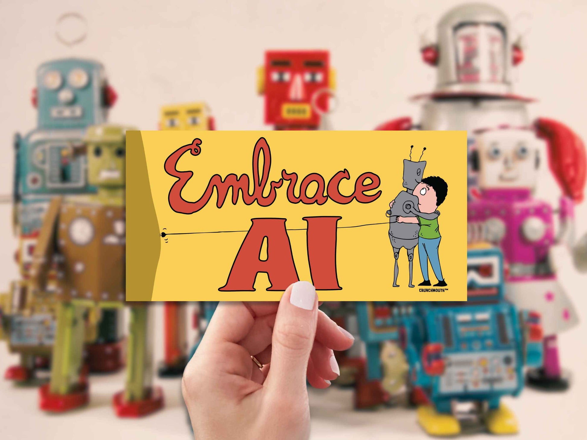 embrace ai satirical bumper sticker, hand display, vintage robot toys background