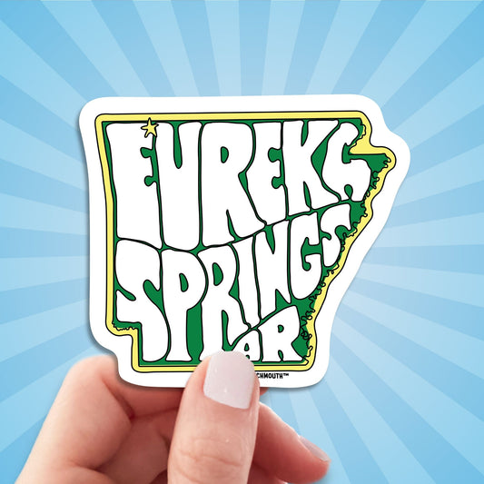 eureka springs travel luggage sticker, hand display, sun rays design background