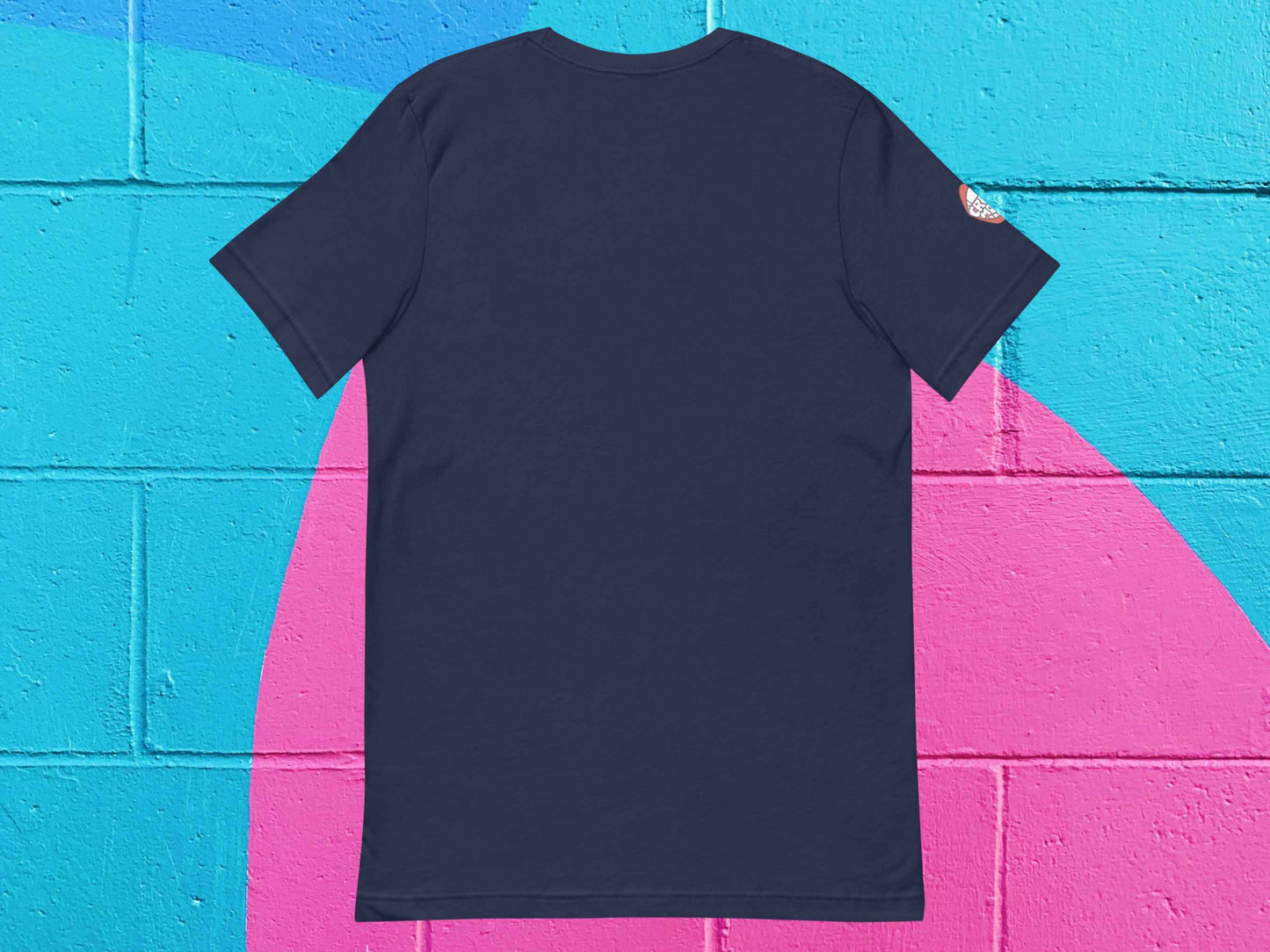 fountain pens t shirt, gifts for artists, express yourself, flat, back view, colorful cinder block wall background