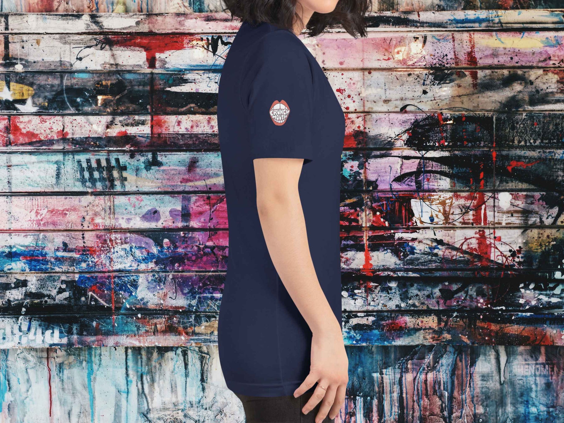 fountain pen t shirt, retro vintage t shirts, female model, right side view, graffiti wall background