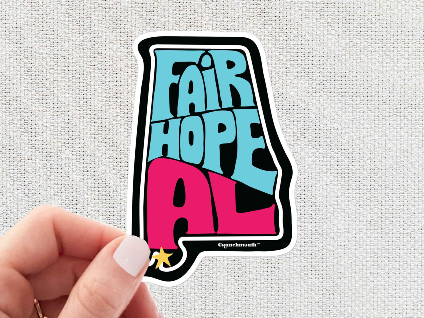 fairhope alabama travel luggage sticker, hand display, white textured background