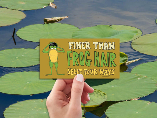 finer than frog hair split four ways bumper sticker, funny greaser frog combing hair, hand display, lily pads on water background