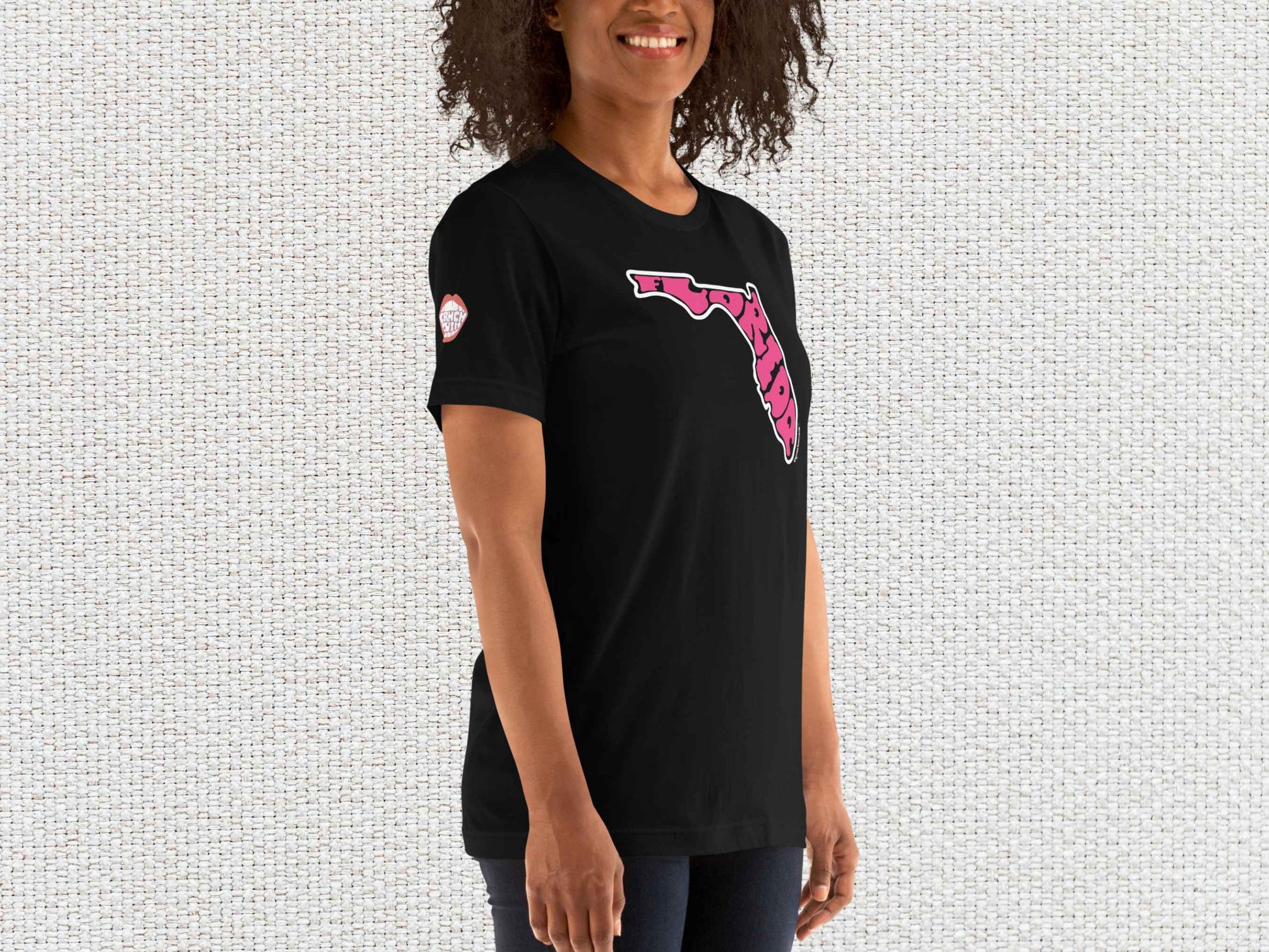 florida shirt, souvenir t shirts, female model, front right, light color textured background