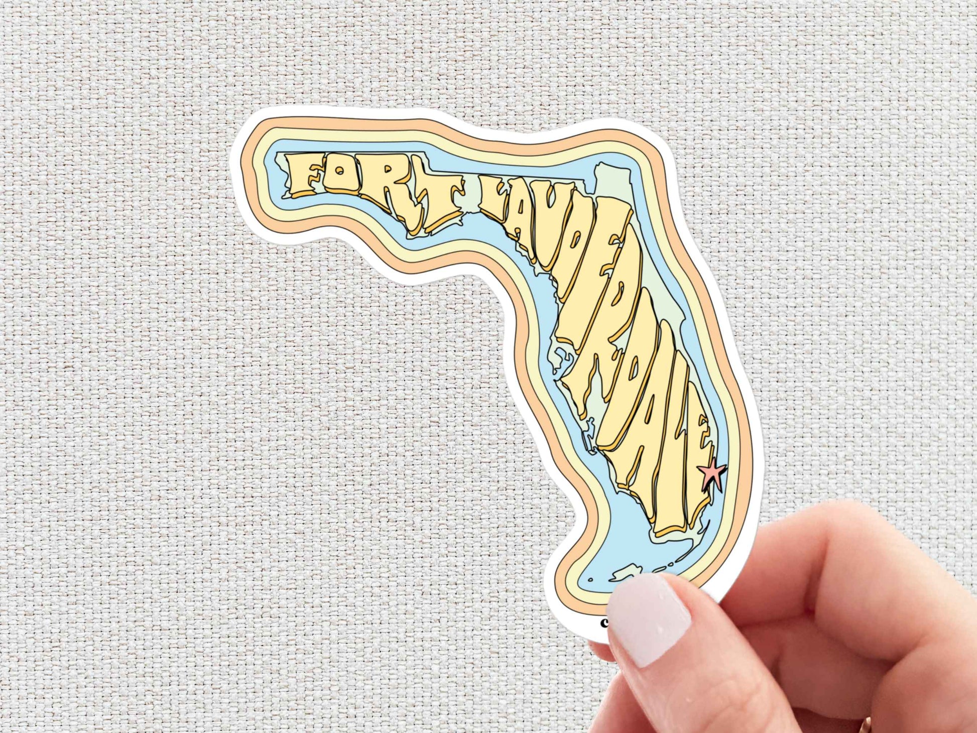 fort lauderdale sticker, hand display, white textured background