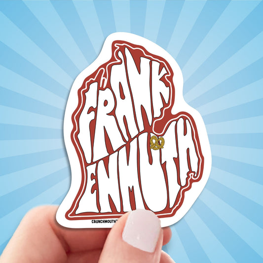 frankenmuth travel luggage sticker, hand display, sun rays design background
