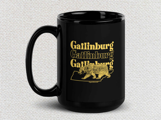 gatlinburg coffee mug, 15oz, black ceramic, handle on left, light color textured background