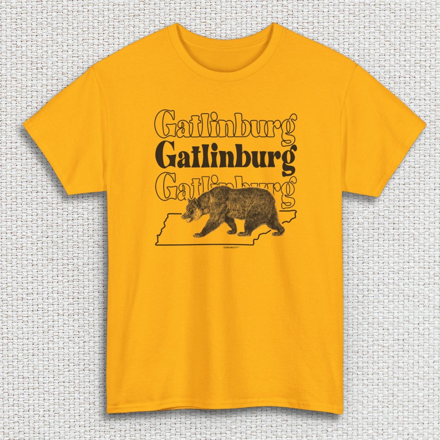 gatlinburg shirt, front, gold color, textured fabric background