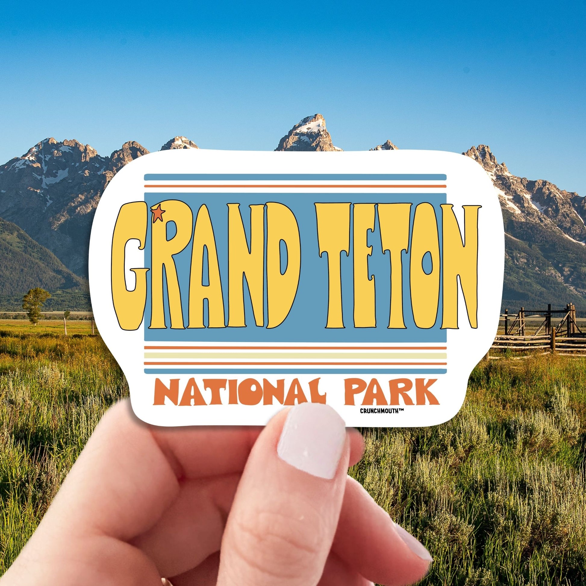 grand teton national park travel luggage sticker, hand display, grand teton wyoming background
