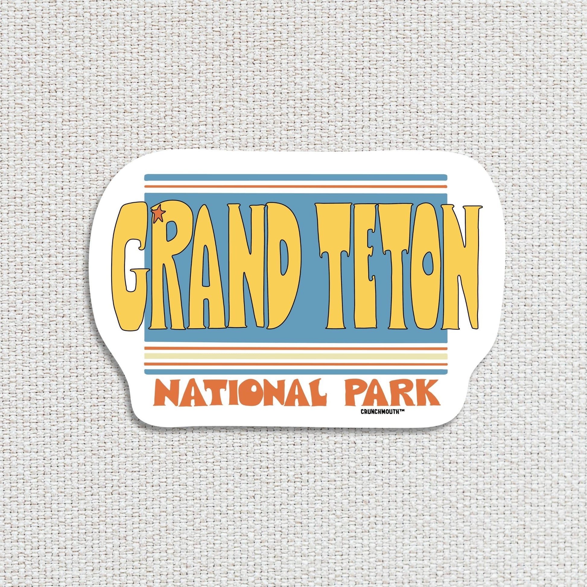 grand teton national park travel luggage sticker, textured fabric background
