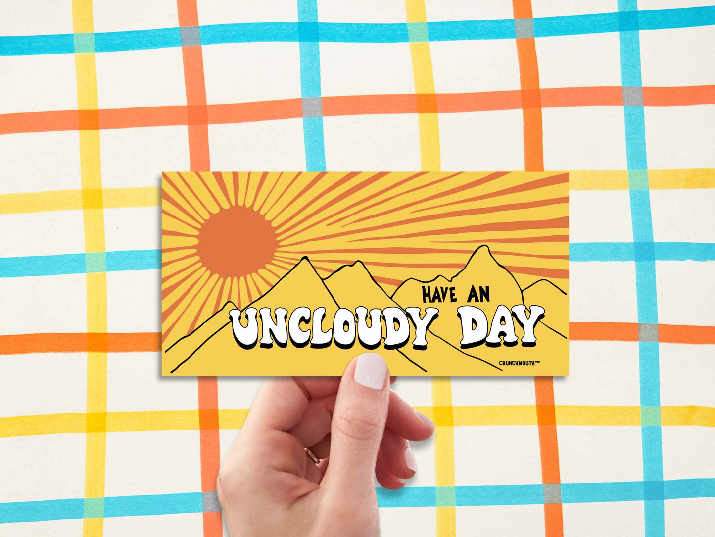 have an uncloudy day bumper sticker, hand display, Checkered Pattern Drawn with Markers background