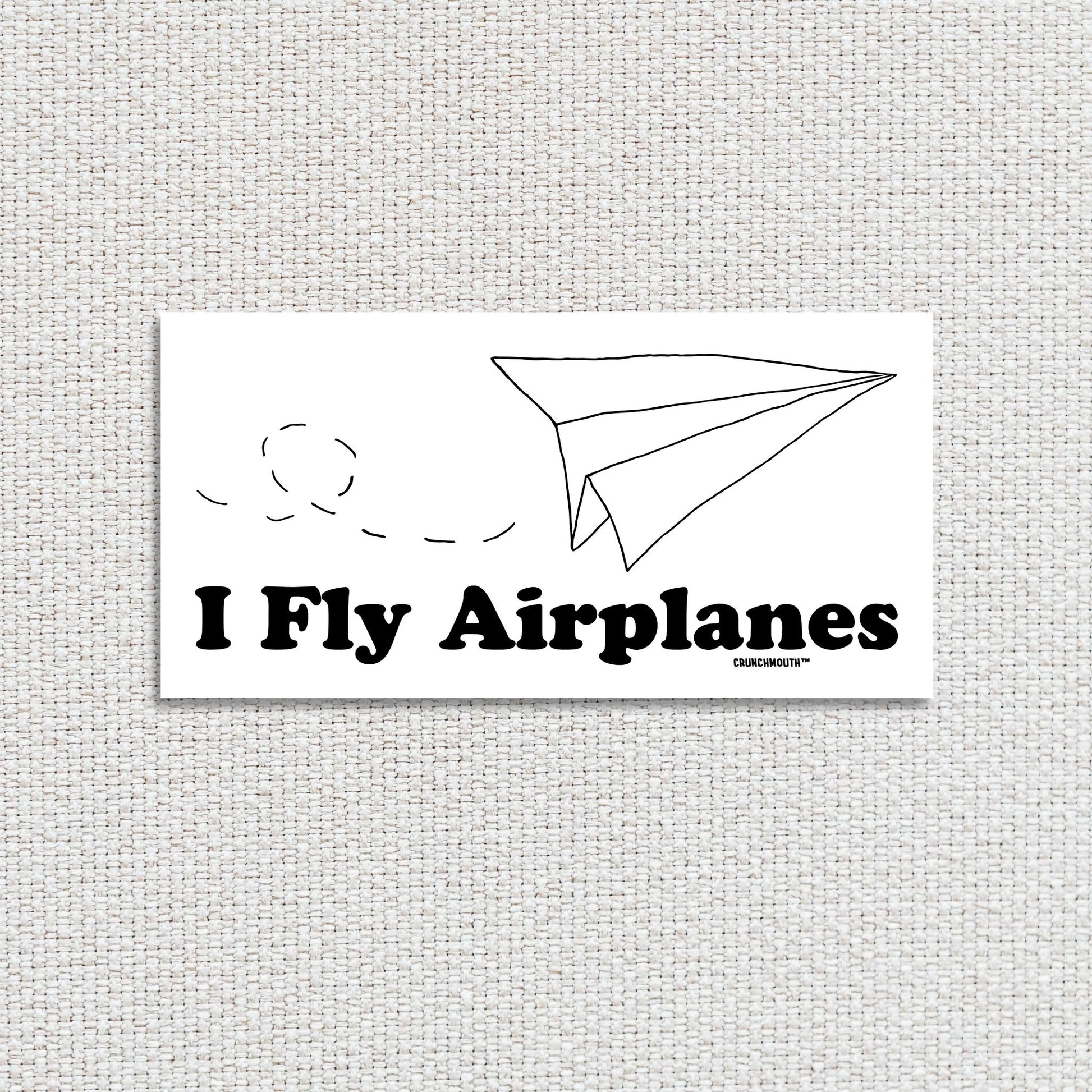 i fly airplanes bumper sticker, textured fabric background
