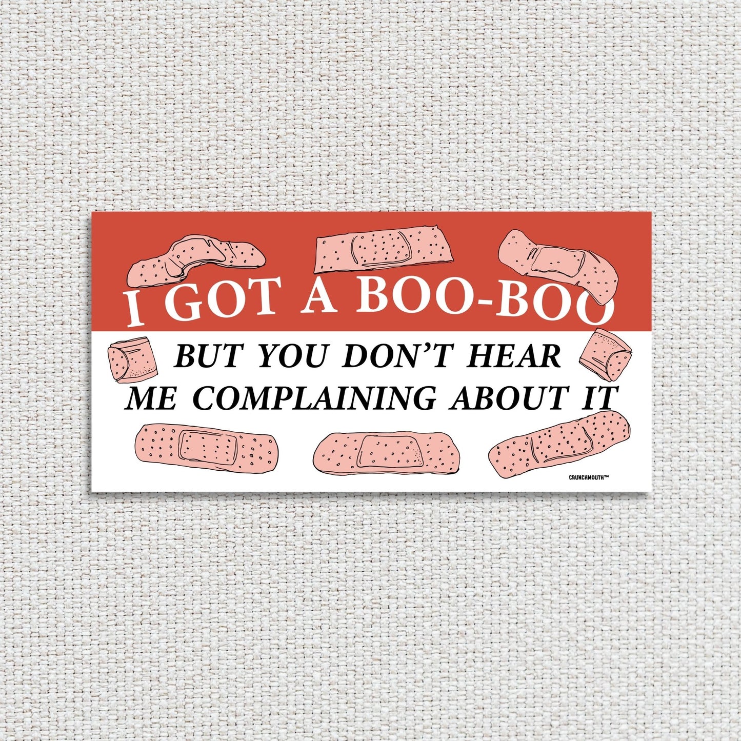 i got a boo-boo but you don't hear me complaining about it bumper sticker,textured fabric background
