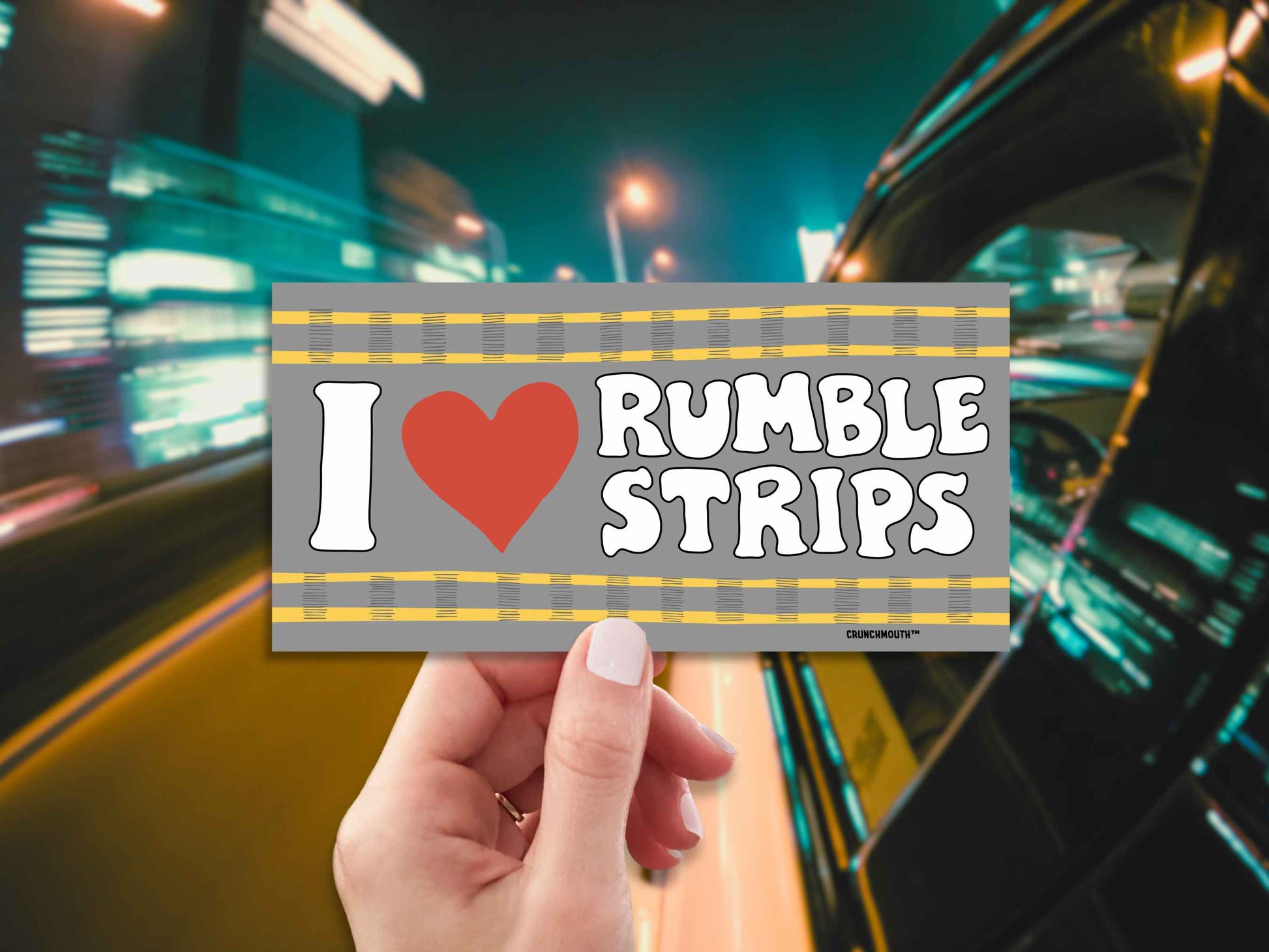 i love rumble strips bumper sticker, hand display, highway at night background