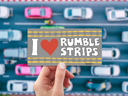 i love rumble strips bumper sticker, hand display, overhead view of traffic background