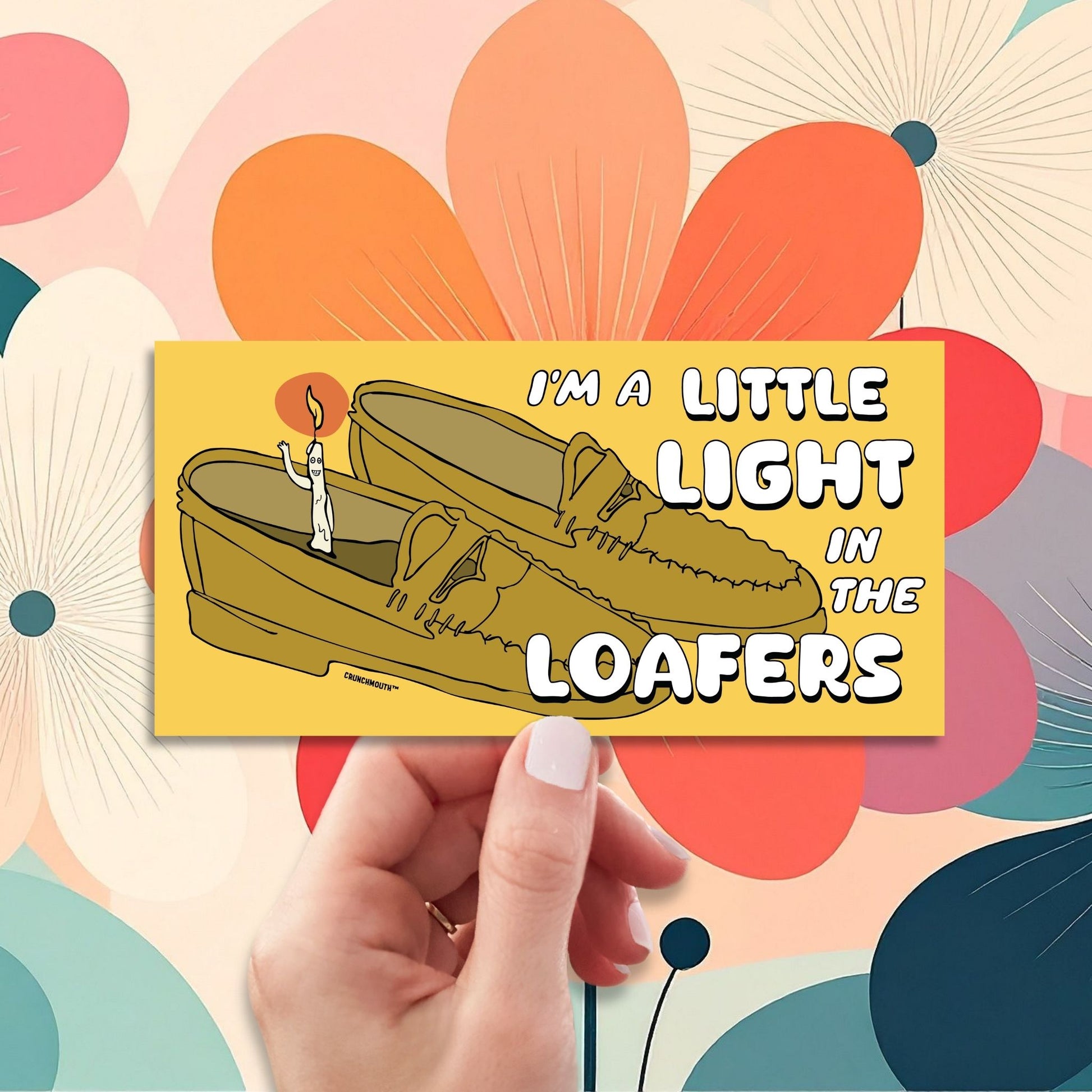 i'm a little light in the loafers bumper sticker, hand display, flowers design background
