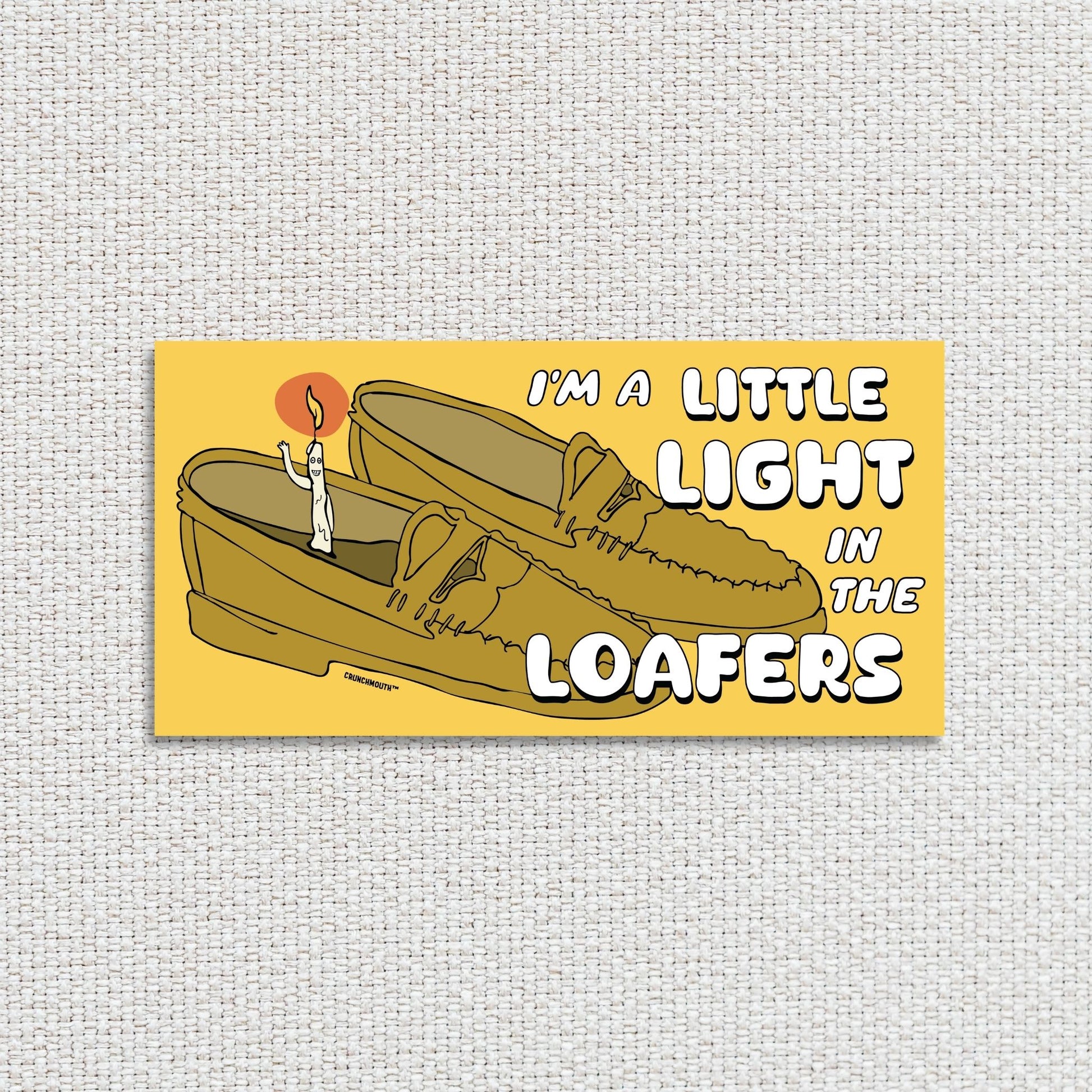 i'm a little light in the loafers bumper sticker, textured fabric background
