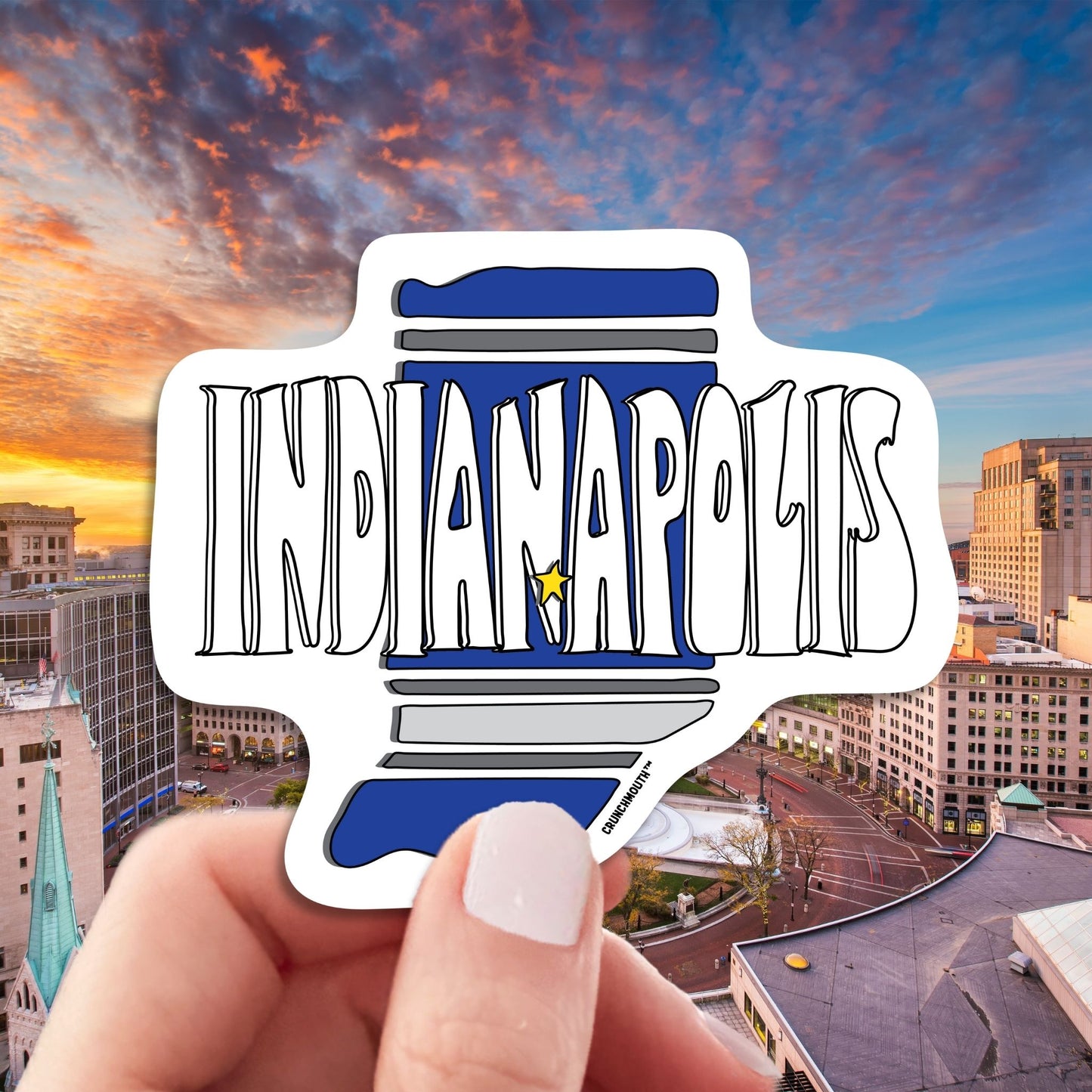 indianapolis travel luggage sticker, hand display, aerial cityscape background