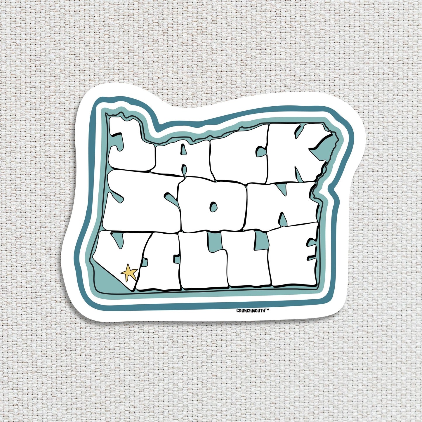 Jacksonville oregon travel luggage sticker, textured fabric background
