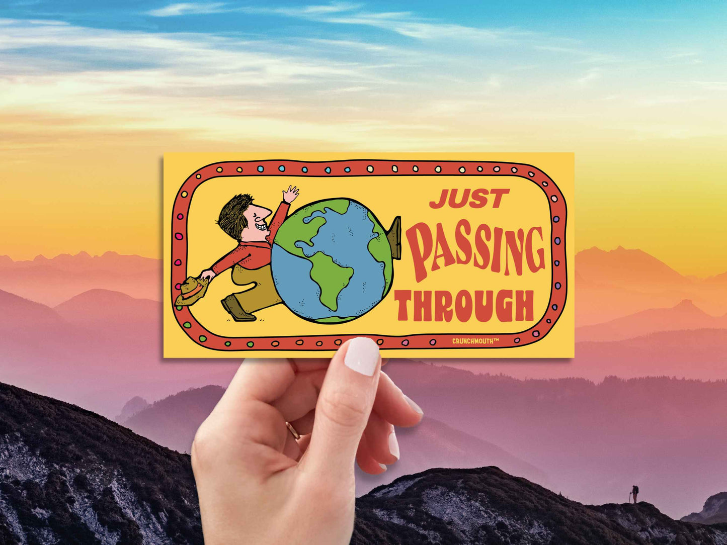 just passing through bumper sticker, hand display, mountain sky background