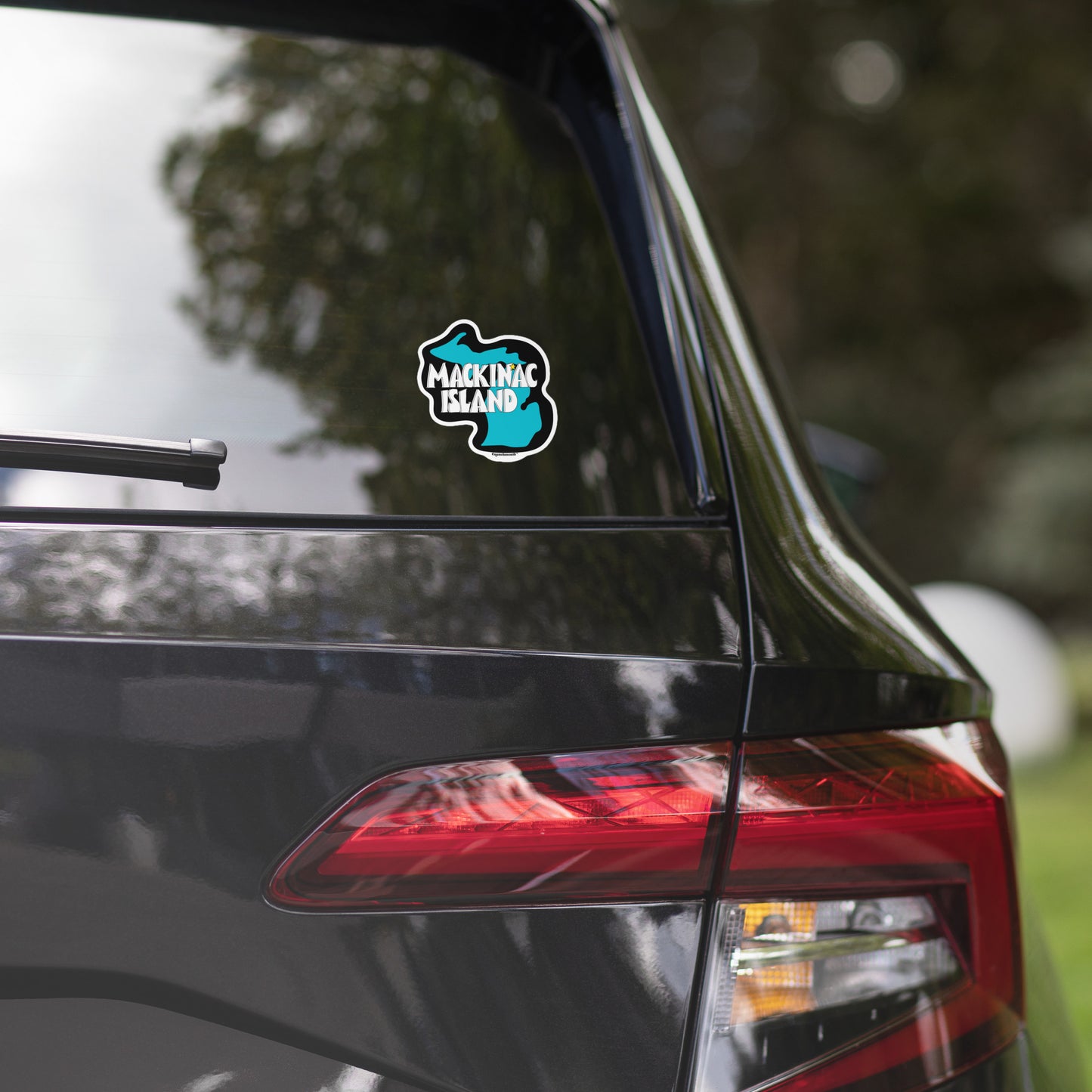 mackinac waterproof indoor outdoor vinyl sticker displayed on rear window of car