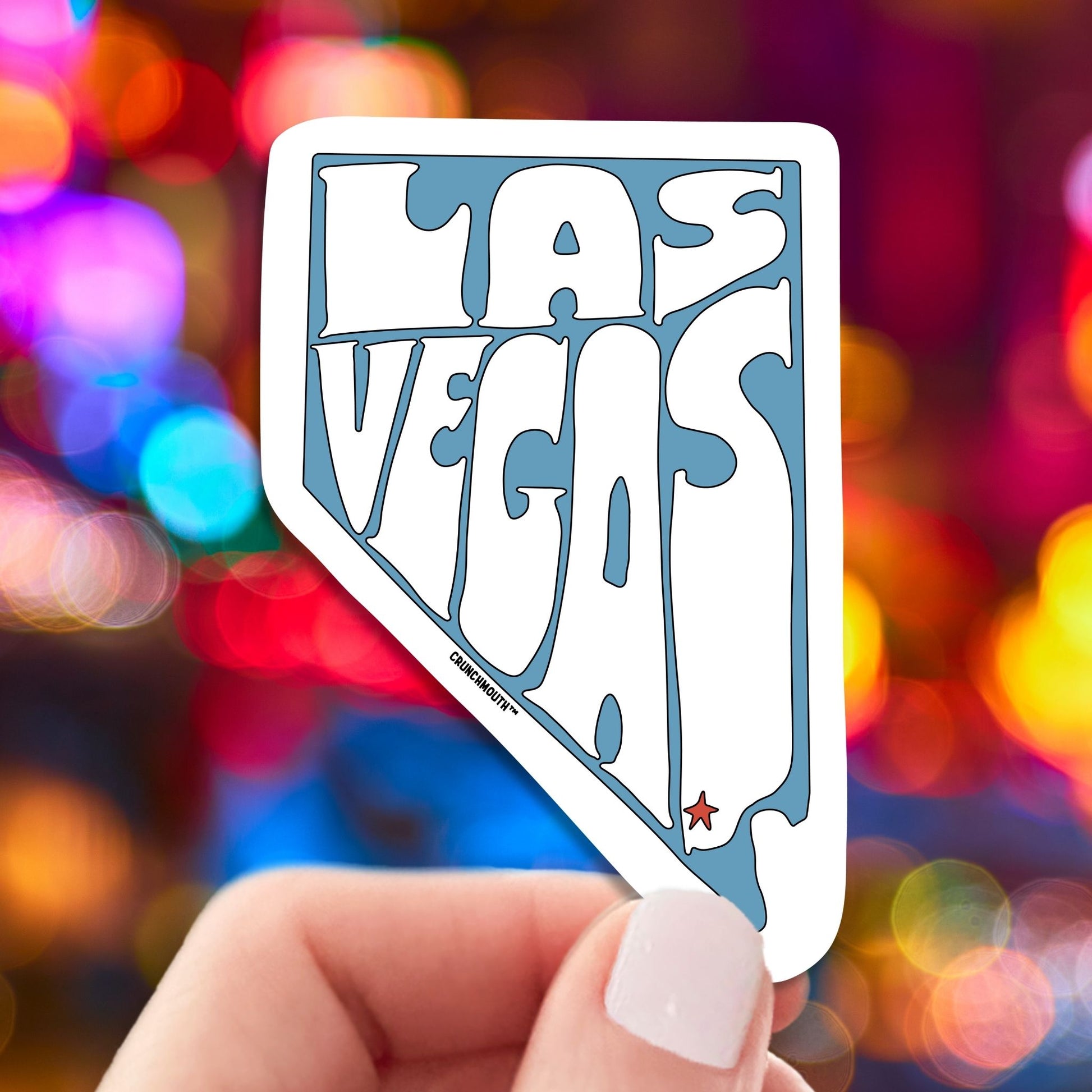 las vegas travel luggage sticker, hand display, city lights background
