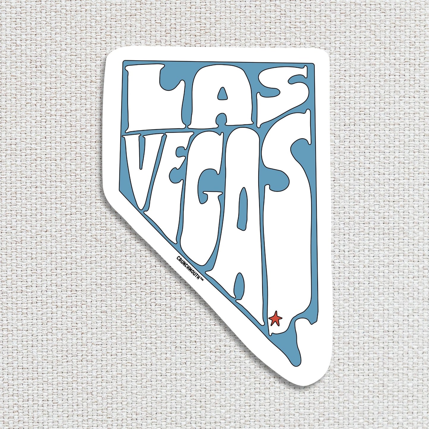 las vegas travel luggage sticker, hand display, textured fabric background
