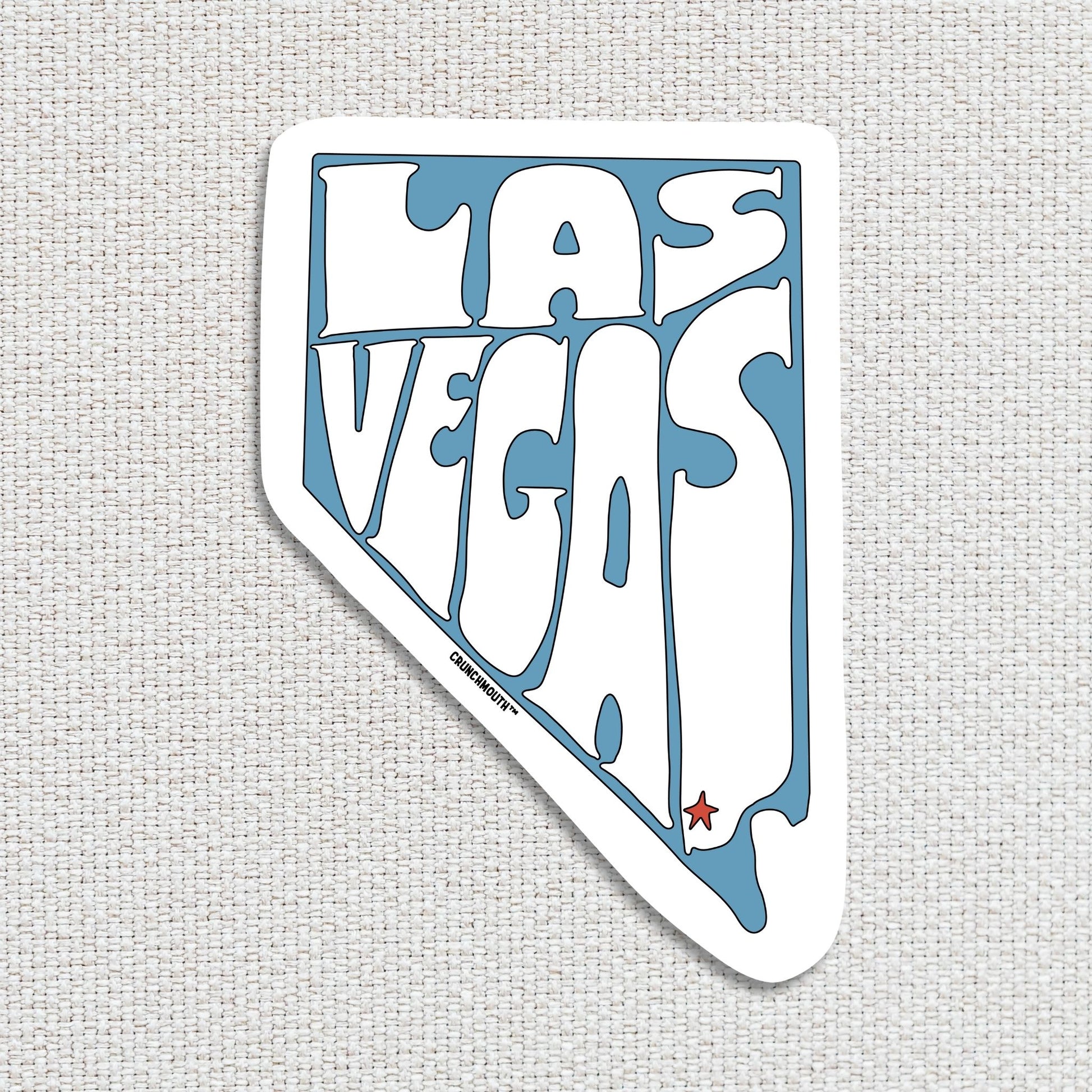 las vegas travel luggage sticker, hand display, textured fabric background
