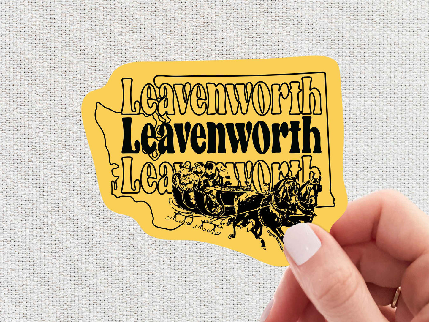 leavenworth sticker, travel luggage stickers, hand display, white textured background