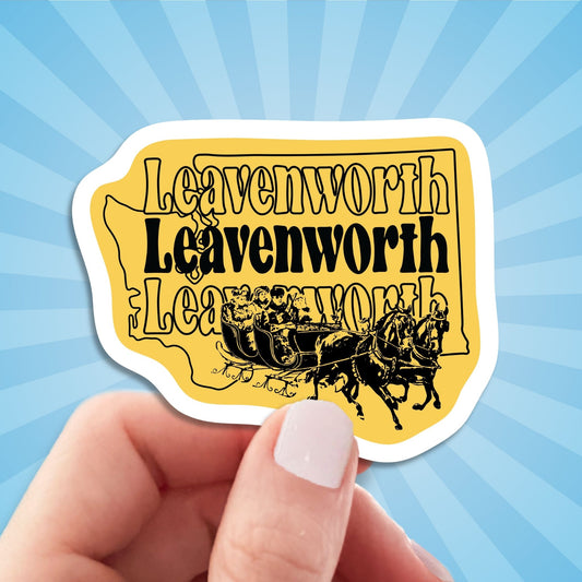 Leavenworth travel luggage sticker, hand display, sun rays design background
