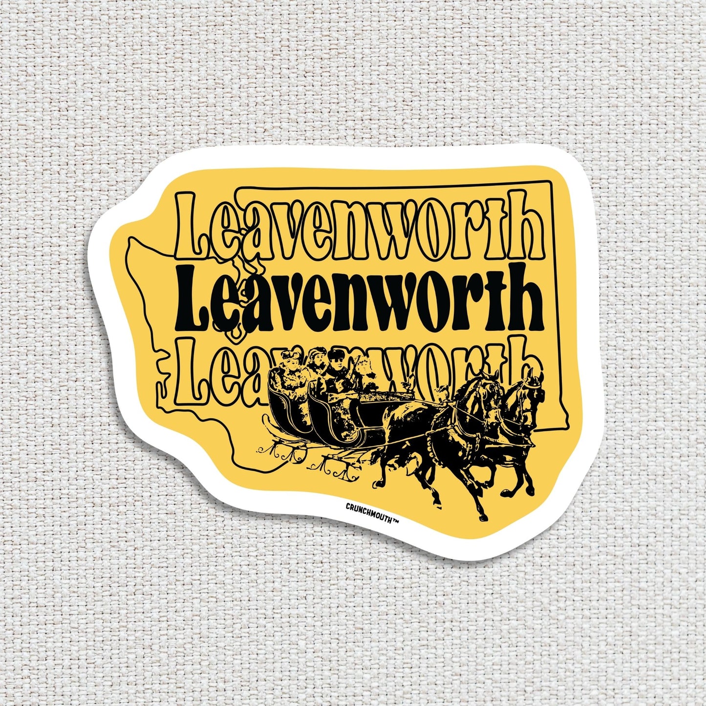 Leavenworth travel luggage sticker, textured fabric background
