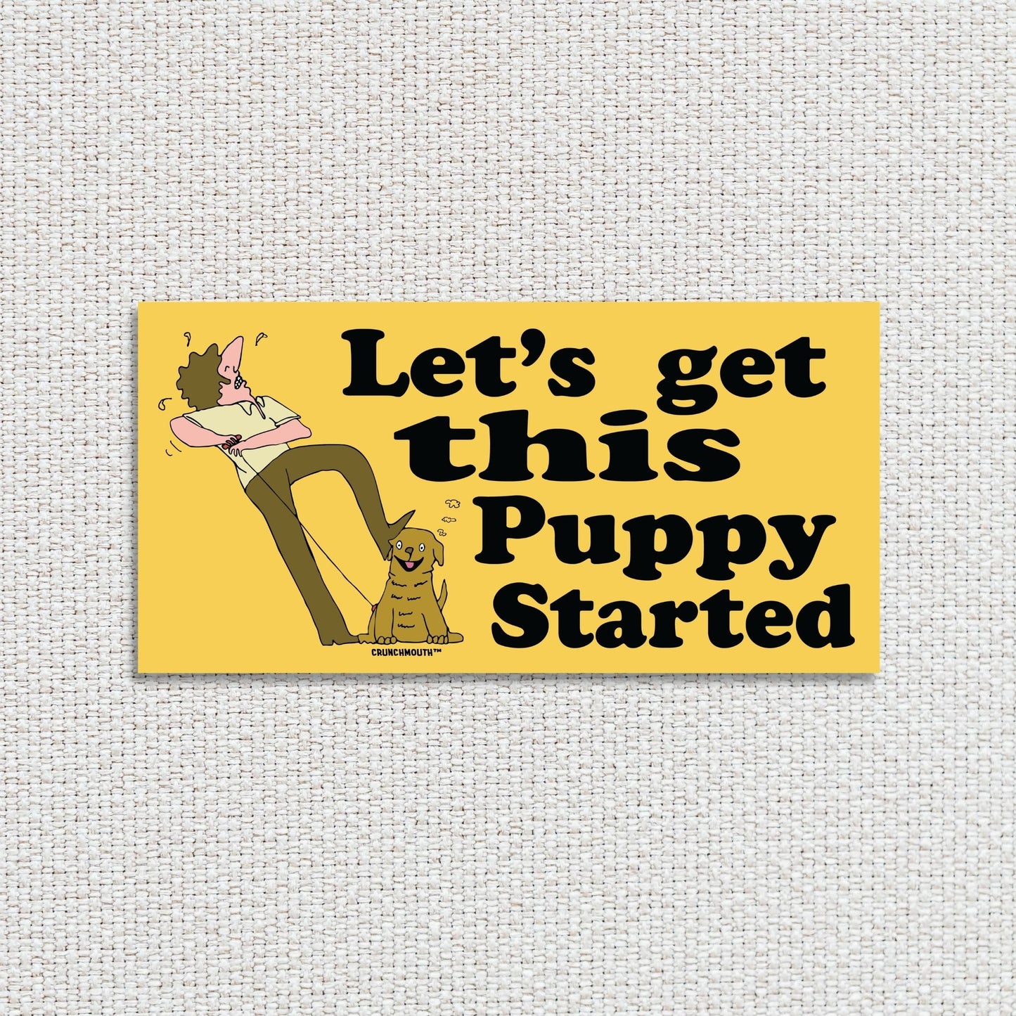 let's get this puppy started bumper sticker, textured fabric background
