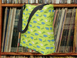 alligator eating hippo pattern tote bag, vinyl record shelf background