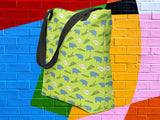 alligator eating hippo pattern tote bag, colorful brick wall background